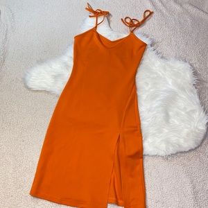 Orange mid length body con dress